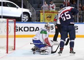 COLOGNE, GERMANY - MAY 6: Slovakia's Mario Bliznak #55 with a scoring chance against Italy's Andreas Bernard #1 during preliminary round action at the 2017 IIHF Ice Hockey World Championship. (Photo by Andre Ringuette/HHOF-IIHF Images)

