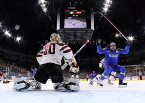 COLOGNE, GERMANY - MAY 9: Italy's Anton Bernard #18 celebrates after a first period goal by Marco Insam #8 (not shown) against Latvia's Elvis Merzlikins #30 during preliminary round action at the 2017 IIHF Ice Hockey World Championship. (Photo by Andre Ringuette/HHOF-IIHF Images)

