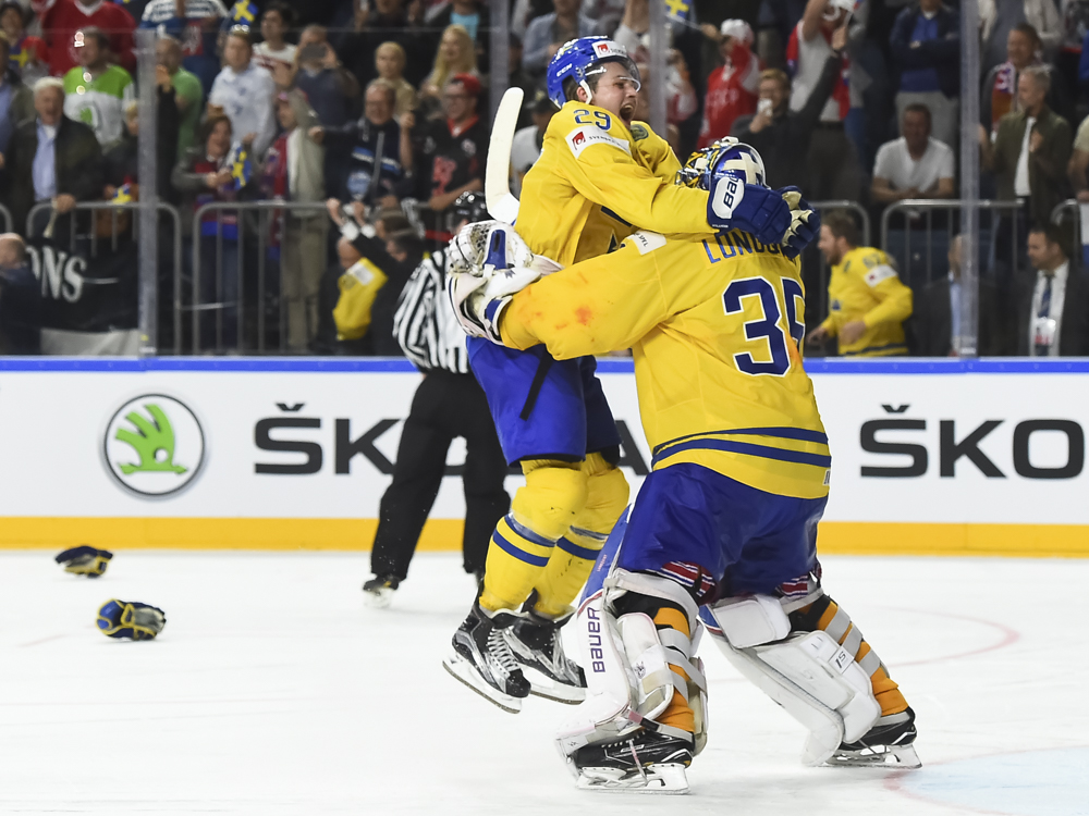 William Nylander tackles Henrik Lundqvist during Sweden's gold