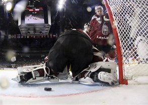 COLOGNE, GERMANY - MAY 7: Latvia's Kristaps Sotnieks #11 looks on as the puck gets through the pads of Elvis Merzlikins #30 during preliminary round action against Slovakia at the 2017 IIHF Ice Hockey World Championship. (Photo by Andre Ringuette/HHOF-IIHF Images)

