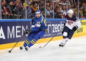 COLOGNE, GERMANY - MAY 8: Sweden's Oliver Ekman-Larsson #23 skates with the puck while USA's Johnny Gaudreau #13 chases him down during  preliminary round action at the 2017 IIHF Ice Hockey World Championship. (Photo by Andre Ringuette/HHOF-IIHF Images)

