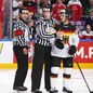 COLOGNE, GERMANY - MAY 12: Linesman Gleb Lazarev holds back Germany's Yasin Ehliz #42 while referee Marcus Linde looks on during preliminary round action against Denmark at the 2017 IIHF Ice Hockey World Championship. (Photo by Andre Ringuette/HHOF-IIHF Images)

