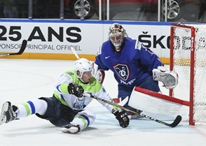 PARIS, FRANCE - MAY 15: Slovenia's Ales Music #16 is tripped by France's Jonathan Janil #3 (not shown) and crashes into Cristobal Huet #39 resulting in a penalty shot during preliminary round action at the 2017 IIHF Ice Hockey World Championship. (Photo by Matt Zambonin/HHOF-IIHF Images)

