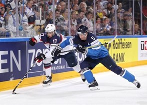 COLOGNE, GERMANY - MAY 18: USA's Nich Schmaltz #17 and Finland's Lasse Kukkonen #5 battle for the puck during quarterfinal round action at the 2017 IIHF Ice Hockey World Championship. (Photo by Andre Ringuette/HHOF-IIHF Images)

